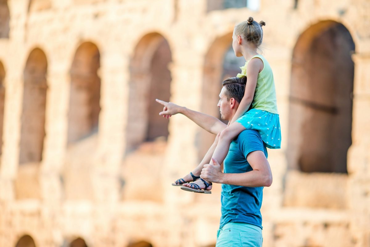 Young father and little girl background Colosseum, Rome, Italy