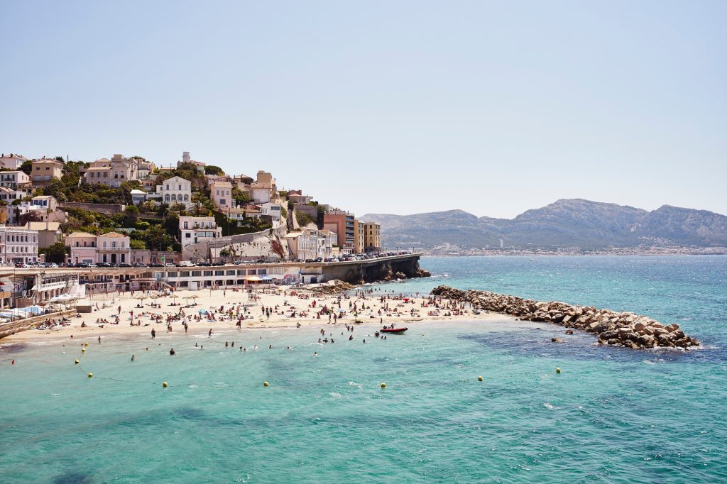 Crowds of holiday makers on coast, Marseille, France