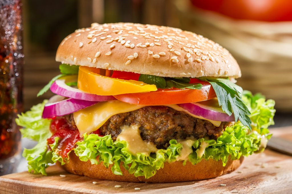 Closeup of homemade hamburger with fresh vegetables
